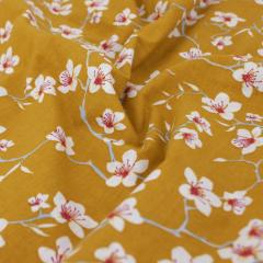 Tissu coton cretonne enduite motif fleurs AMANDIER jaune Safran
